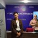 Дві жінки під час заходу в приміщенні Городоцької сільської ради; на фоні — банер громади та презентація програми «Ти як? — Маршрути підтримки кожного в громаді».